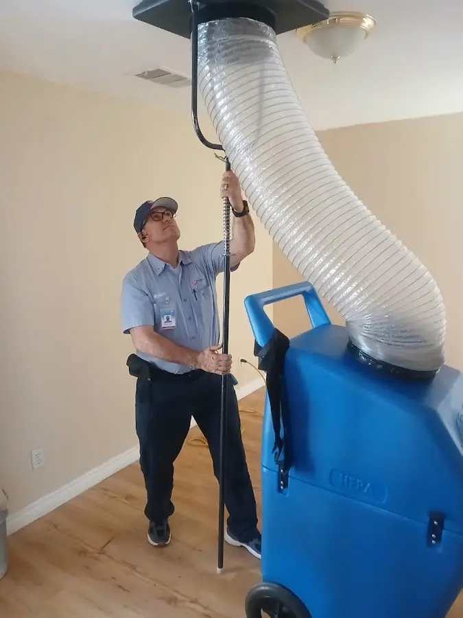Furnace Tune-Up technician using HEPA equipment in Sugarland Run